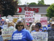 Protesters march down Jefferson Avenue past the site of the Tops massacre during a March for Our Lives rally in support of gun control, Saturday, June 11, 2022, in Buffalo, N.Y.