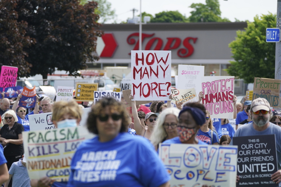 Protesters march down Jefferson Avenue past the site of the Tops massacre during a March for Our Lives rally in support of gun control, Saturday, June 11, 2022, in Buffalo, N.Y.