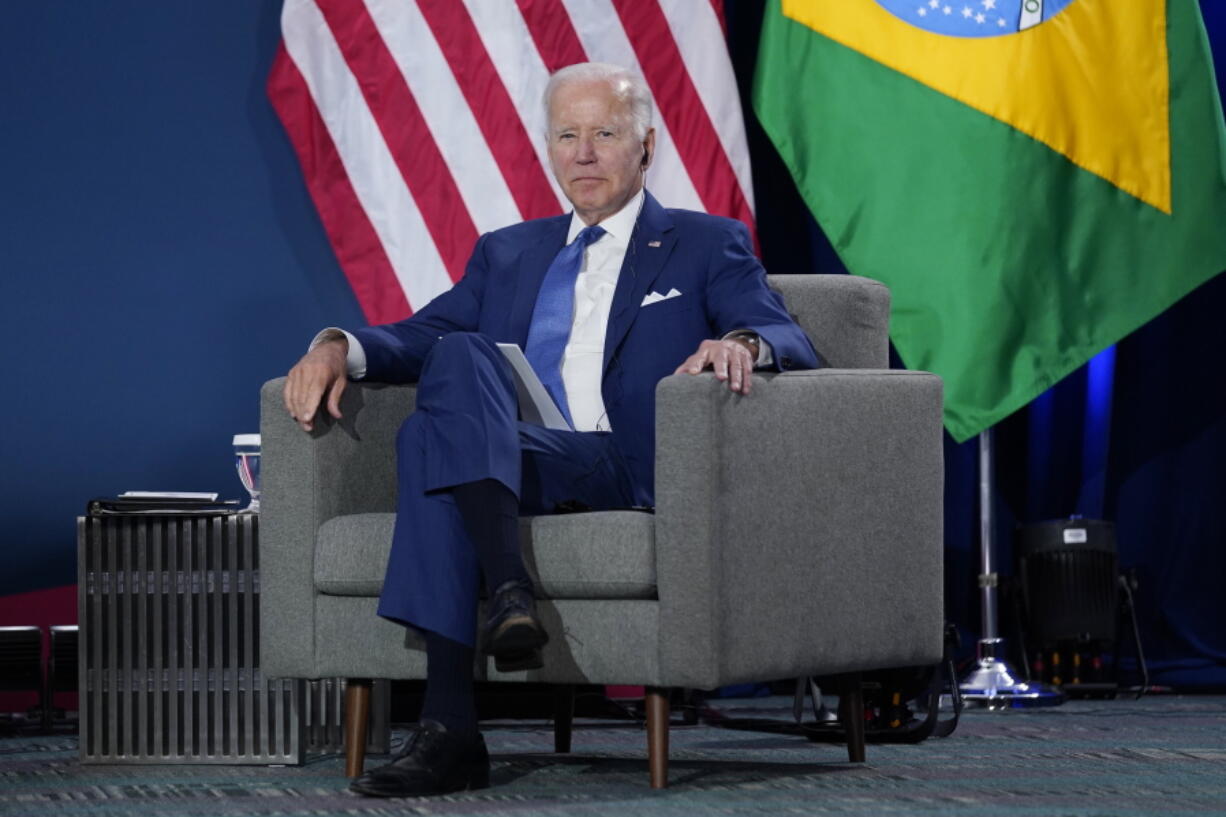 President Joe Biden listens at a meeting with Brazilian President Jair Bolsonaro during the Summit of the Americas, Thursday, June 9, 2022, in Los Angeles.