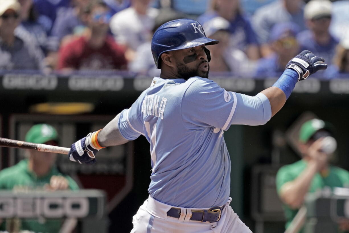 Kansas City Royals' Carlos Santana hits a two-run single during the sixth inning of a baseball game against the Oakland Athletics Sunday, June 26, 2022, in Kansas City, Mo.