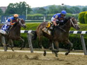 Mo Donegal (6), with jockey Irad Ortiz Jr., pulls away from Nest (3), with Jose Ortiz, before crossing the finish line to win the 154th running of the Belmont Stakes horse race, Saturday, June 11, 2022, at Belmont Park in Elmont, N.Y.