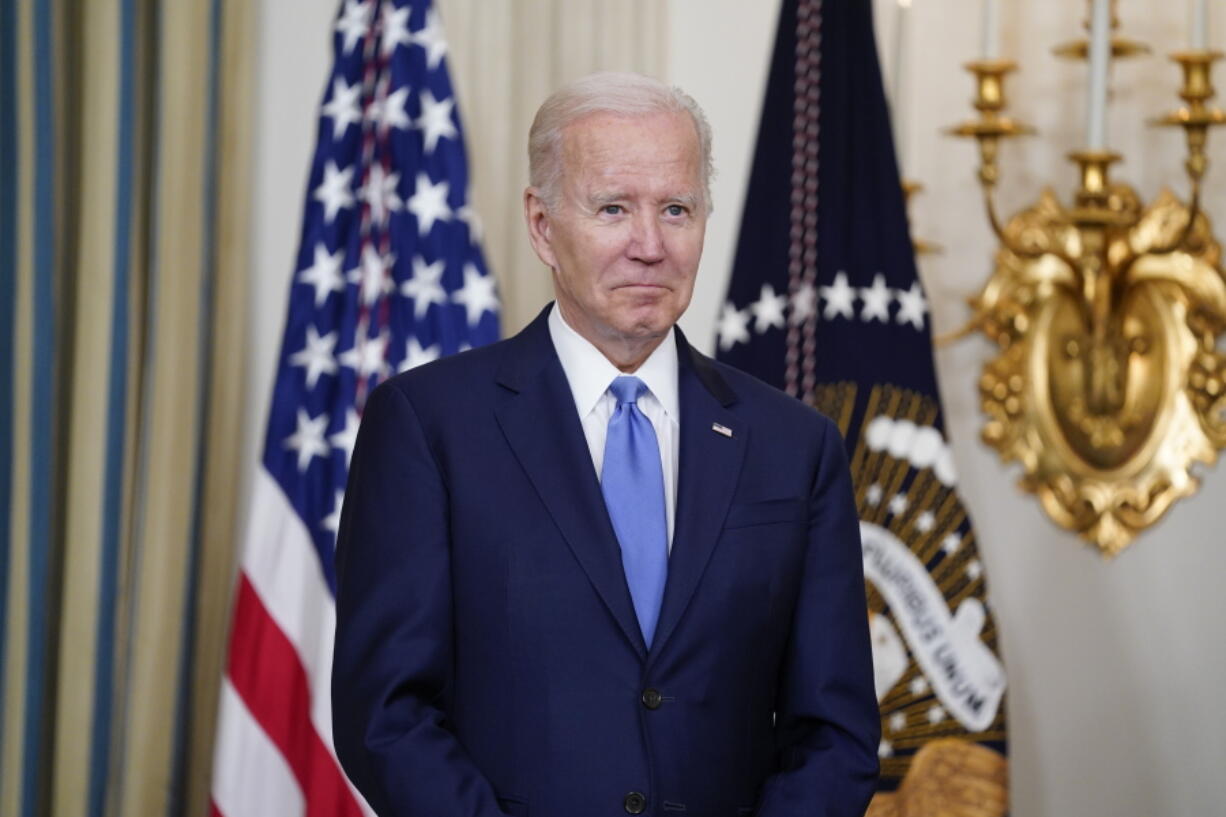 President Joe Biden listens as Vincent Duvall, President of the American Farm Bureau Federation, introduces him to speak in the State Dining Room of the White House, Thursday, June 16, 2022, in Washington.