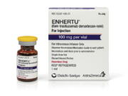 This undated photo provided by Daiichi Sankyo and AstraZeneca in June 2022 shows a vial and packaging for their Enhertu, an antibody-chemotherapy drug administered intravenously.