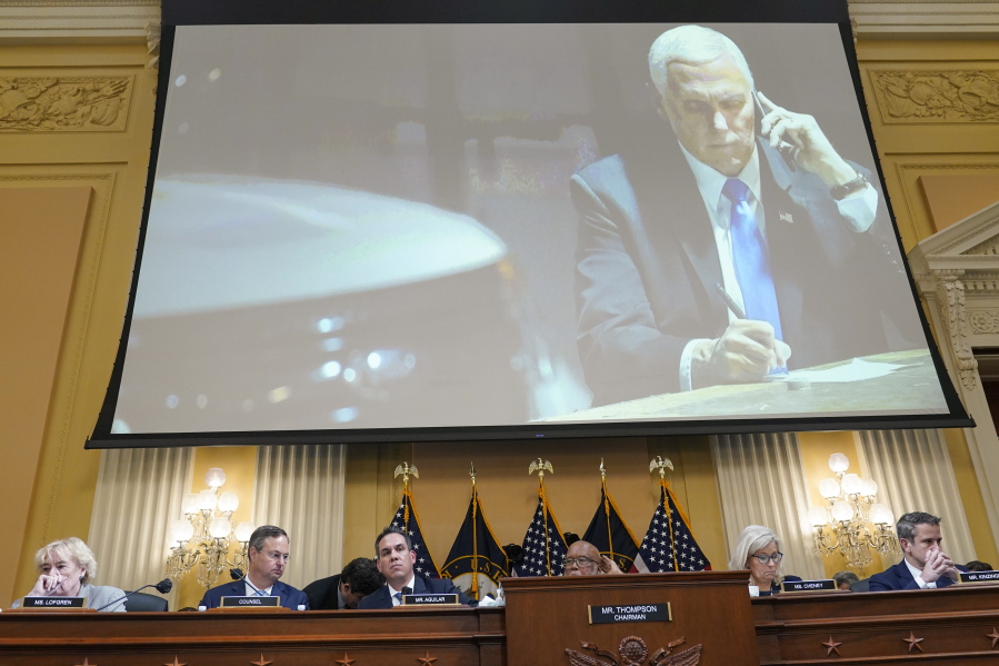 A committee exhibit shows former Vice President Mike Pence talking on the phone from his secure location during the riot, as the House select committee investigating the Jan. 6, 2021, attack on the Capitol holds a hearing at the Capitol in Washington, Thursday, June 16, 2022.