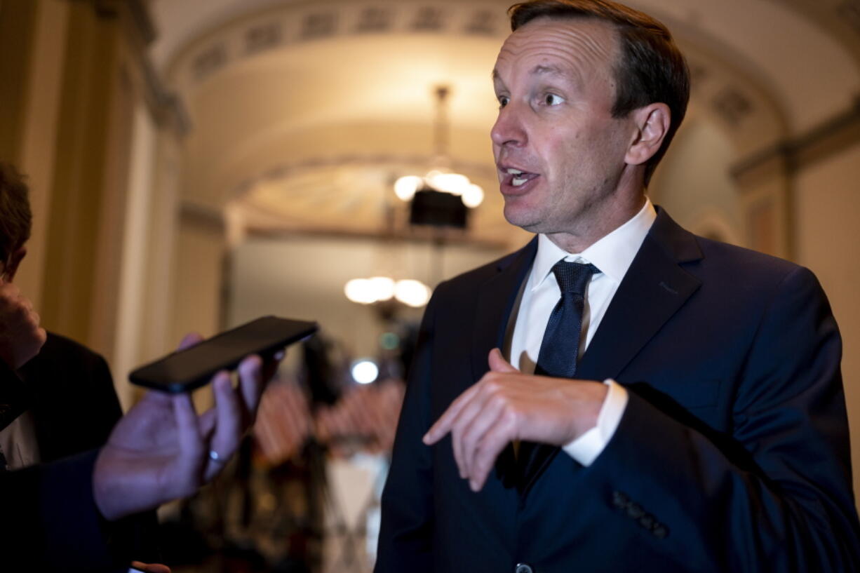 FILE -Sen. Chris Murphy, D-Conn., who has led the Democrats in bipartisan Senate talks to rein in gun violence, pauses for questions from reporters, at the Capitol in Washington, Wednesday, June 22, 2022. The Senate on Thursday, June 23, 2022 easily approved a bipartisan gun violence bill that seemed unthinkable just a month ago, clearing the way for final congressional approval of what will be lawmakers' most far-reaching response in decades to the nation's run of brutal mass shootings. (AP Photo/J.