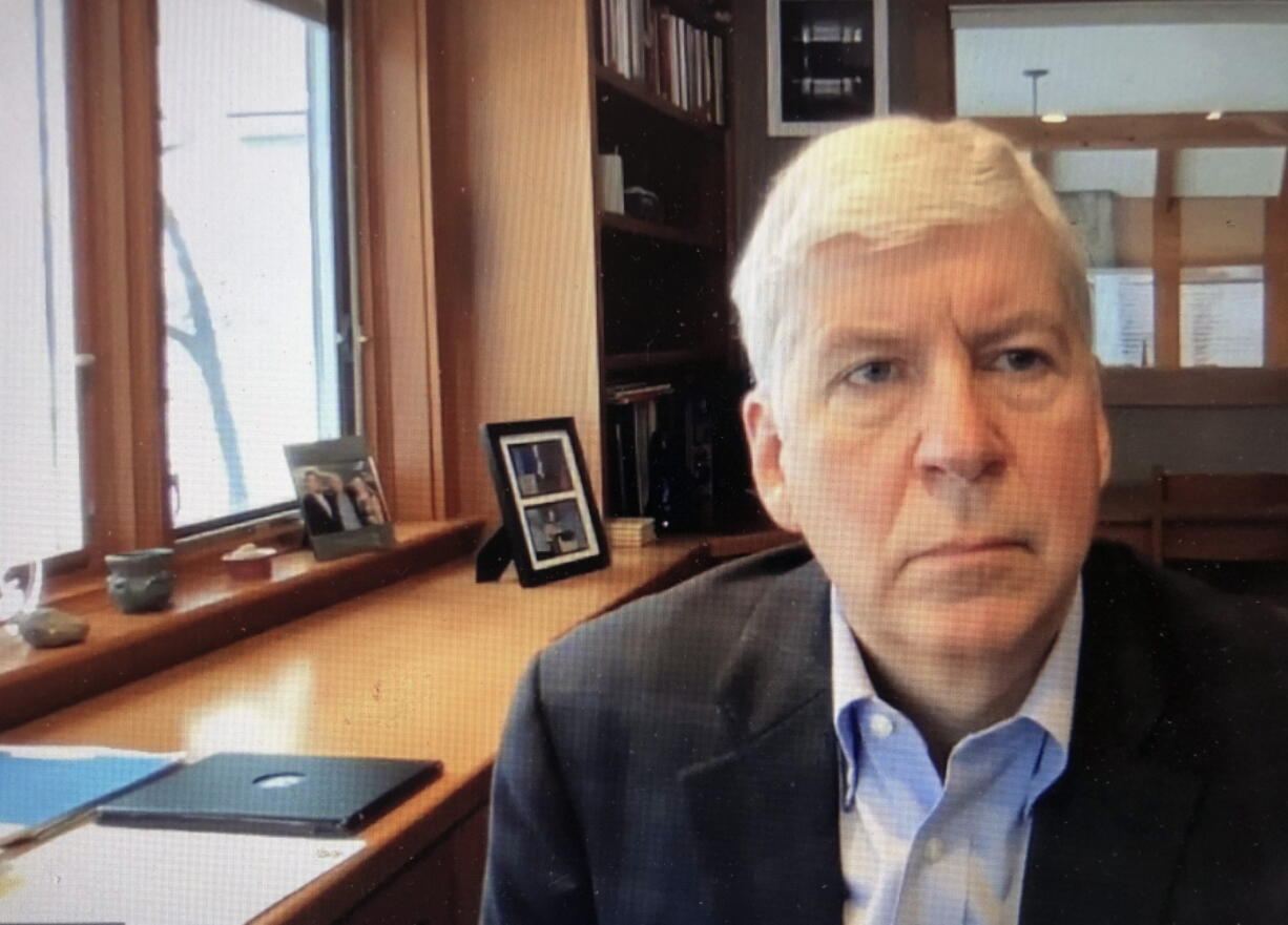 FILE - This screen shot from video, shows former Michigan Gov. Rick Snyder, during his Zoom hearing in the 67th District Court in Flint, Mich., on Jan. 18, 2020. A judge had no authority to issue indictments in the Flint water scandal, the Michigan Supreme Court said Tuesday, June 28, 2022 in an extraordinary decision that wipes out charges against former Gov.