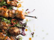 This image released by Milk Street shows a recipe for Maple and Soy-Glazed Chicken Skewers.