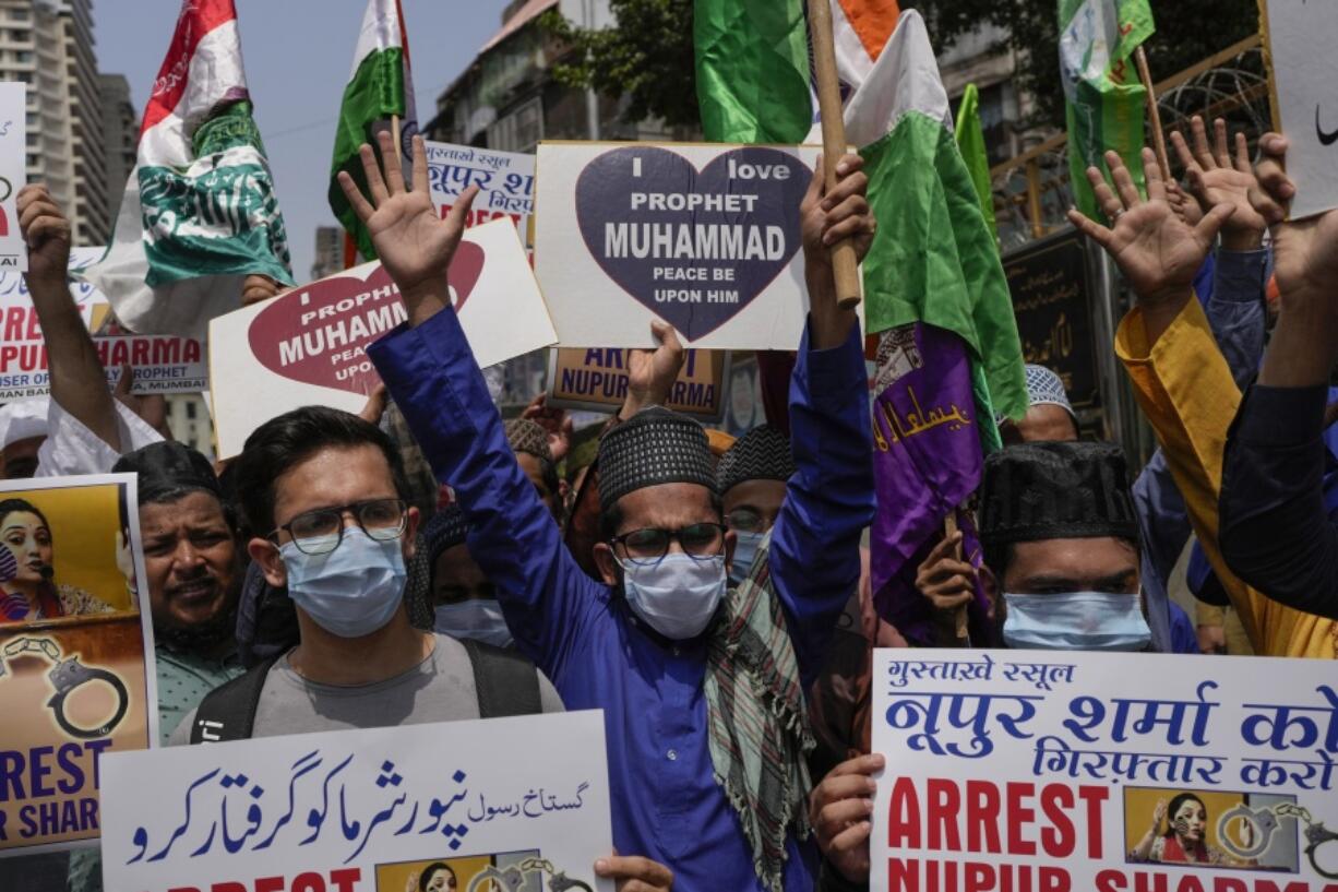 Indian Muslims shout slogans as they react to the derogatory references to Islam and the Prophet Muhammad made by top officials in the governing Hindu nationalist party during a protest in Mumbai, India, Monday, June 6, 2022. At least five Arab nations have lodged official protests against India, and Pakistan and Afghanistan also reacted strongly Monday to the comments made by two prominent spokespeople from Prime Minister Narendra Modi's Bharatiya Janata Party.