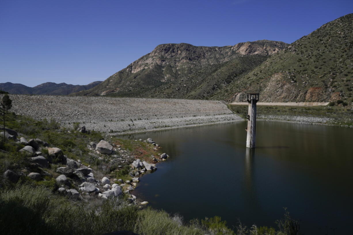 FILE - The dam at El Capitan Reservoir is seen April 8, 2022, in Lakeside, Calif. Eight years after Congress created the program, the U.S. Army Corps of Engineers is taking a first step Friday, June 10, 2022, toward offering more than $7 billion of federally backed loans to repair aging dams owned by states, local governments and private entities across the U.S.