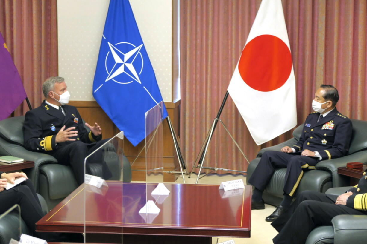 NATO Military Committee chief Rob Bauer, left, meets with Japanese Chief of Staff Koji Yamazaki, right, at the defense ministry in Tokyo, Tuesday, June 7, 2022.