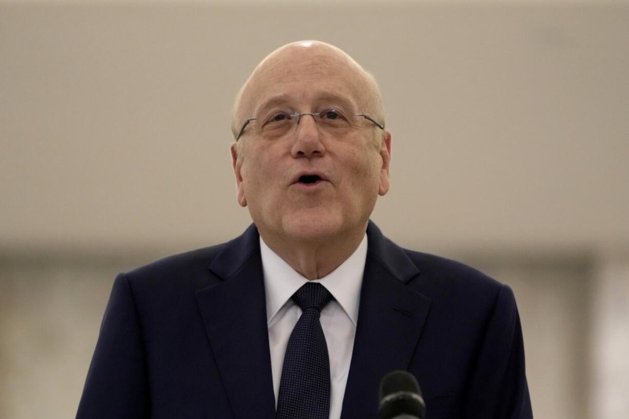 Lebanese Prime Minister-designate Najib Mikati, speaks to journalists after his meeting with Lebanese President Michel Aoun, at the Presidential Palace in Baabda, east of Beirut, Lebanon, Thursday, June 23, 2022. President Aoun appointed Mikati, a billionaire businessman and former prime minister as the next premier-designate after his consultations with members of parliamentary blocs to name a new prime minister following last month's parliamentary elections.