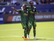 Portland Timbers forward Yimmi Chara, left, celebrates with midfielder Santiago Moreno after scoring against the Los Angeles Galaxy during the first half of an MLS soccer match in Carson, Calif., Saturday, June 18, 2022.
