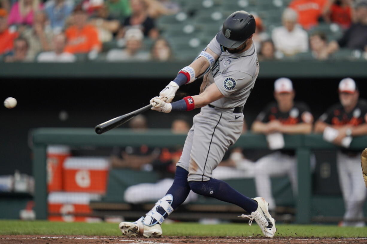 Seattle Mariners' Jesse Winker connects for an RBI single to score Taylor Trammell during the third inning of a baseball game against the Baltimore Orioles, Thursday, June 2, 2022, in Baltimore.