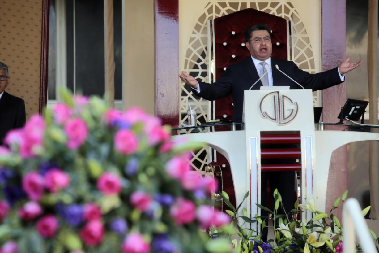 FILE - Naas?n Joaqu?n Garc?a leads a service at his church "La Luz del Mundo" in Guadalajara, Mexico on Aug. 9, 2018. Garc?a, the leader of the Mexican megachurch La Luz del Mundo, pleaded guilty Friday, June 3, 2022, to sexually abusing three girls, California state prosecutors said.