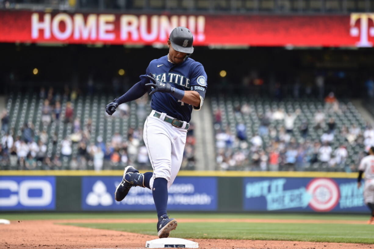 Seattle Mariners' Julio Rodriguez rounds the bases after hitting a two-run home run against the Baltimore Orioles during the fourth inning of a baseball game, Wednesday, June 29, 2022, in Seattle.