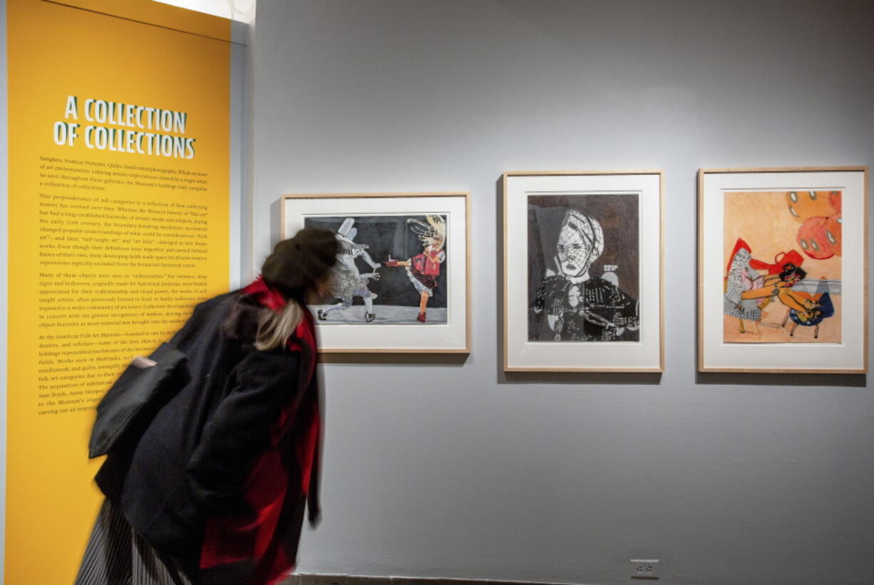 A visitor examines exhibits in the permanent collection of the American Folk Art Museum in January 2022, in New York City. On Tuesday, June 28, 2022, the museum plans to announce its largest and most unusual recent gift, a $5 million donation from Arkansas-based arts supporters Becky and Bob Alexander, to help fund the museum's exhibition program and its operation as one of New York City's few free museums.