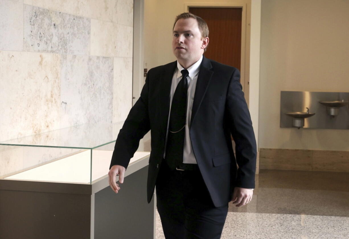 FILE - Aaron Dean, who is charged in the murder of Atatiana Jefferson, walks into the courtroom following a break in the third day of a pretrial hearing Wednesday, May 4, 2022, in Fort Worth, Texas. A new judge must be assigned to oversee the murder case against Dean, a former Texas police officer after defense attorneys successfully argued that the initial judge must recuse himself. Retired Second Court of Appeals Justice Lee Gabriel issued the decision Tuesday, June 28, after hearing arguments last week.