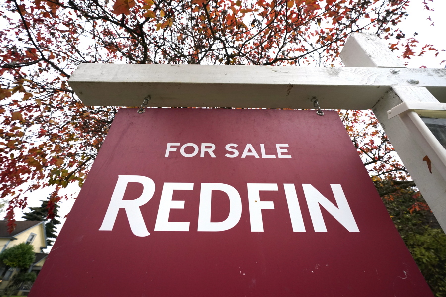 FILE - A Redfin "for sale" sign stands in front of a house on Oct. 28, 2020, in Seattle.