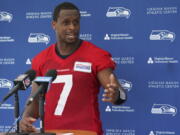 Seattle Seahawks quarterback Geno Smith talks to reporters after NFL football practice Wednesday, June 8, 2022, in Renton, Wash. (AP Photo/Ted S.