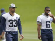 Seahawks strong safety Jamal Adams (33) and free safety Quandre Diggs (6) walk on the field minicamp practice Tuesday in Renton. (Ted S.