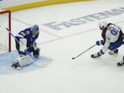 Colorado Avalanche center Nazem Kadri (91) shoots the puck past Tampa Bay Lightning goaltender Andrei Vasilevskiy (88) for a goal during overtime of Game 4 of the NHL hockey Stanley Cup Finals on Wednesday, June 22, 2022, in Tampa, Fla.