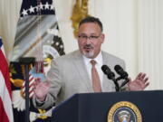 FILE - Education Secretary Miguel Cardona speaks during the 2022 National and State Teachers of the Year event in the East Room of the White House in Washington, April 27, 2022. The Biden administration says it will forgive all remaining federal student debt for former students of the for-profit Corinthian Colleges chain. "As of today, every student deceived, defrauded and driven into debt by Corinthian Colleges can rest assured that the Biden-Harris Administration has their back and will discharge their federal student loans," Cardona said.