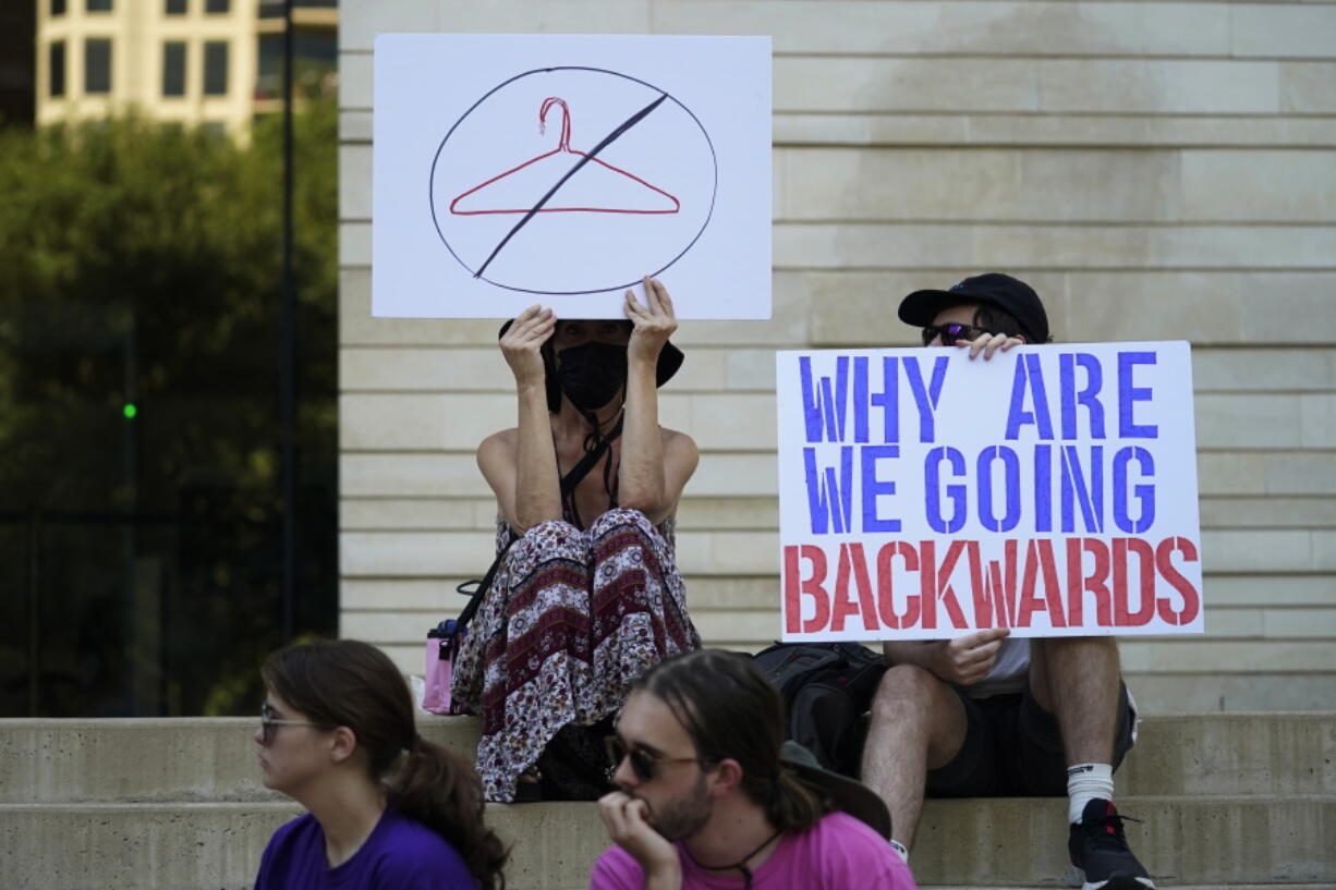 FILE - Demonstrators gather at the federal courthouse following the Supreme Court's decision to overturn Roe v. Wade, June 24, 2022, in Austin, Texas. Some opponents of the decision are feeling despair over the historic rollback of the 1973 case Roe V. Wade legalizing abortion. If a right so central to the overall fight for women's equality can be revoked, they ask, what does it mean for the progress women have made in public life in the intervening 50 years?