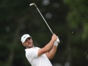 Brooks Koepka watches his shot on the 11th hole during the second round of the U.S. Open golf tournament at The Country Club, Friday, June 17, 2022, in Brookline, Mass. (AP Photo/Robert F.