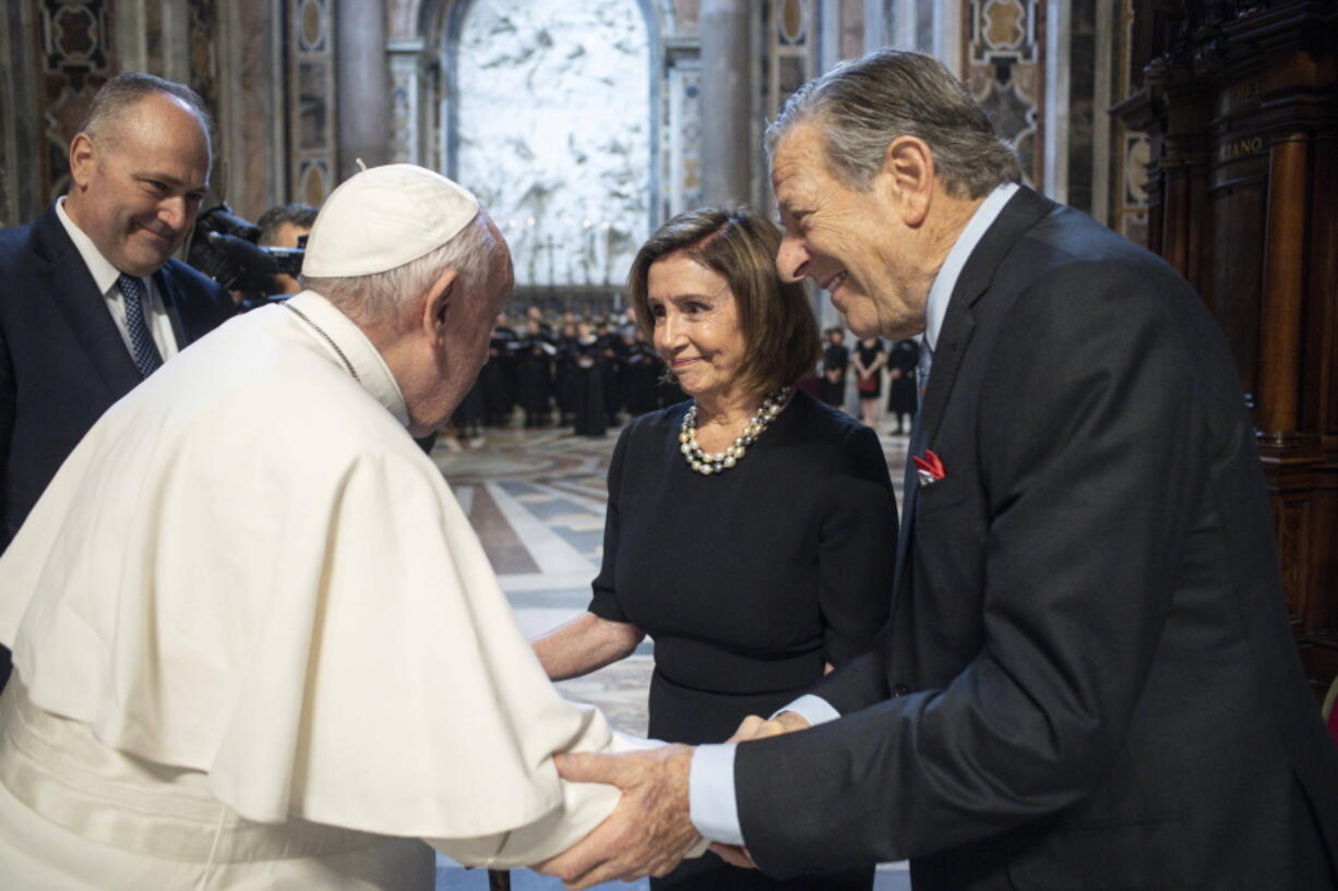 Pope Francis, greets Speaker of the House Nancy Pelosi, D-Calif., and her husband, Paul Pelosi before celebrating a Mass on the Solemnity of Saints Peter and Paul, in St. Peter's Basilica at the Vatican, Wednesday, June 29, 2022. Pelosi met with Pope Francis on Wednesday and received Communion during a papal Mass in St. Peter's Basilica, witnesses said, despite her position in support of abortion rights.