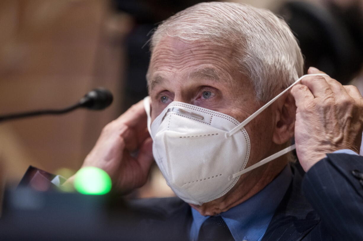 FILE - Dr. Anthony Fauci, director of the National Institute of Allergy and Infectious Diseases, listens during a Senate Appropriations Subcommittee on Labor, Health and Human Services, and Education, and Related Agencies hearing on Capitol Hill in Washington, Tuesday, May 17, 2022. Fauci, who is fully vaccinated and has received two booster shots, tested positive for COVID-19, and was experiencing mild coronavirus symptoms, according to a Wednesday, June 15, 2022, press release posted by the NIH.