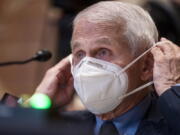 FILE - Dr. Anthony Fauci, director of the National Institute of Allergy and Infectious Diseases, listens during a Senate Appropriations Subcommittee on Labor, Health and Human Services, and Education, and Related Agencies hearing on Capitol Hill in Washington, Tuesday, May 17, 2022. Fauci, who is fully vaccinated and has received two booster shots, tested positive for COVID-19, and was experiencing mild coronavirus symptoms, according to a Wednesday, June 15, 2022, press release posted by the NIH.