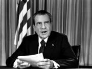 FILE - President Nixon sits in his White House office on Aug. 16, 1973, as he poses for photographer after delivering a nationwide television address dealing with Watergate. Nixon repeated that he had no prior knowledge of the Watergate break-in and was not aware of any cover-up.