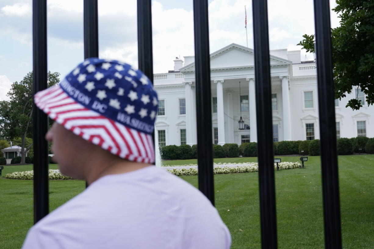 FILE - The North Lawn of the White House is seen from a newly reopened section of Pennsylvania Avenue, July 4, 2021, in Washington. The White House has announced they will resume a full operating schedule for public tours beginning July 19, 2022.