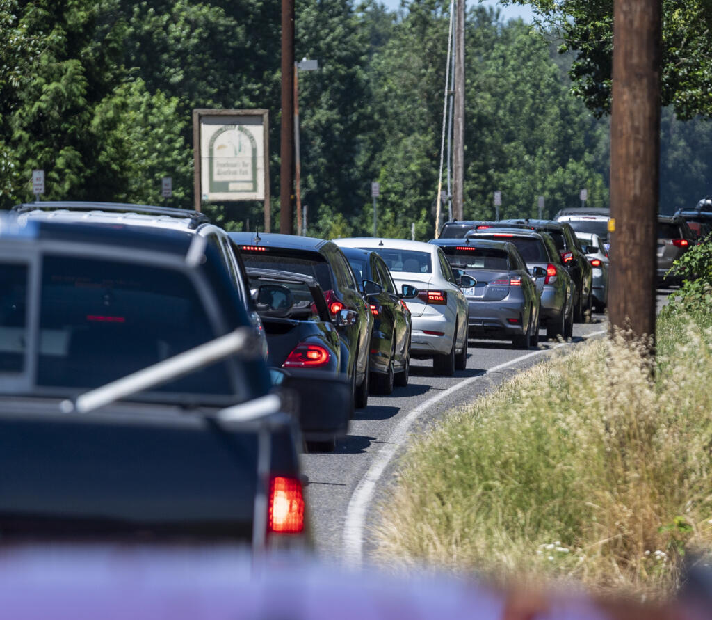 Cars line up trying to get into Frenchman's Bar Regional Park on July 11. As temperatures hit triple digits this week, more people will head to the water to find sport to cool off.