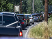 Cars line up trying to get into Frenchman's Bar Regional Park on July 11. As temperatures hit triple digits this week, more people will head to the water to find sport to cool off.