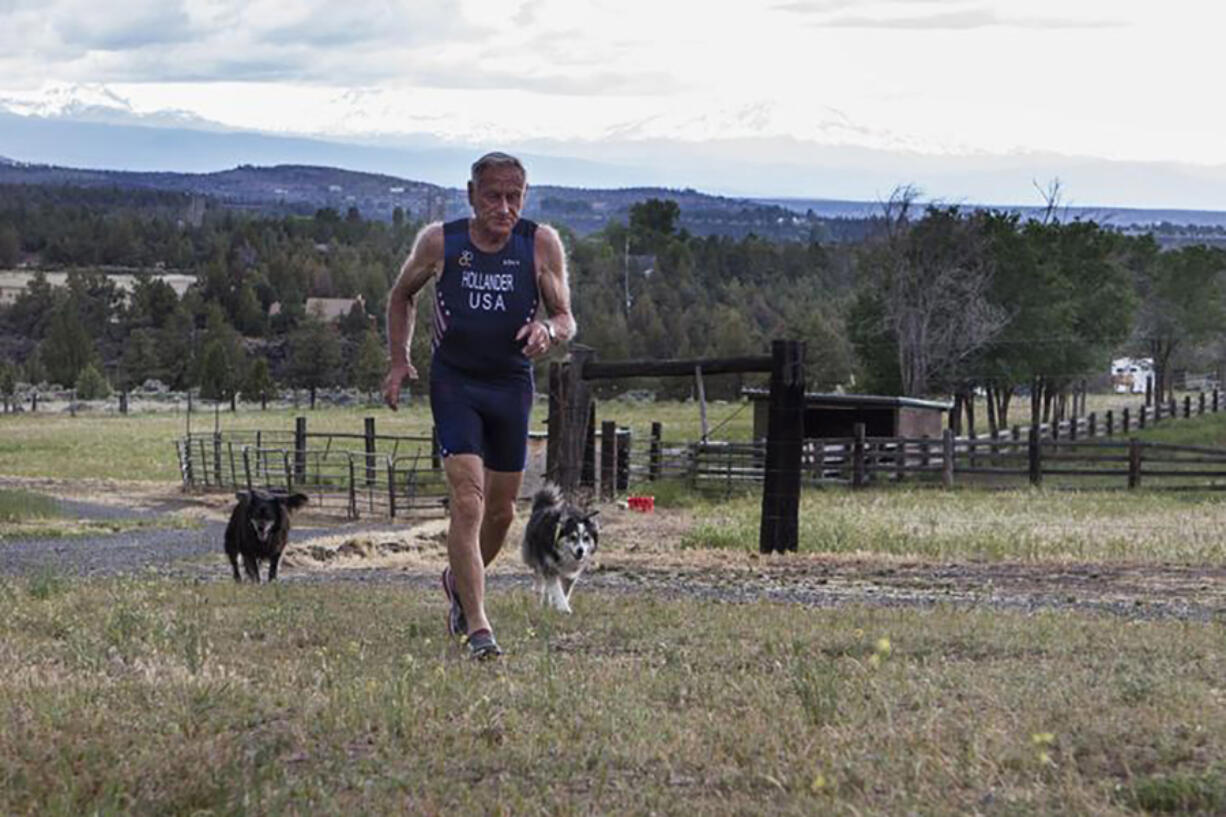 Lew Hollander runs up the driveway of his home in Terrebonne, Ore.