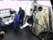 In this image made from video supplied by NASA, astronaut Kayla Barron exits the SpaceX Dragon space capsule after splashing down in the Gulf of Mexico off Tampa, Florida, early Friday, May 6, 2022. NASA???s Barron, Raja Chari, Tom Marshburn and the European Space Agency???s Matthias Maurer undocked from the International Space Station less than 24 hours earlier.