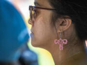 Phoebe Kingsak, 23, listens to speakers at the Bans Off Our Bodies protest outside of the Tarrant County, Texas, Courthouse on June 25.