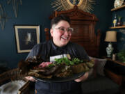 Chef/Partner Wendy Lopez shows Mediterranean seabass pibil at Reyes Mezcaleria in Orlando, Fla.