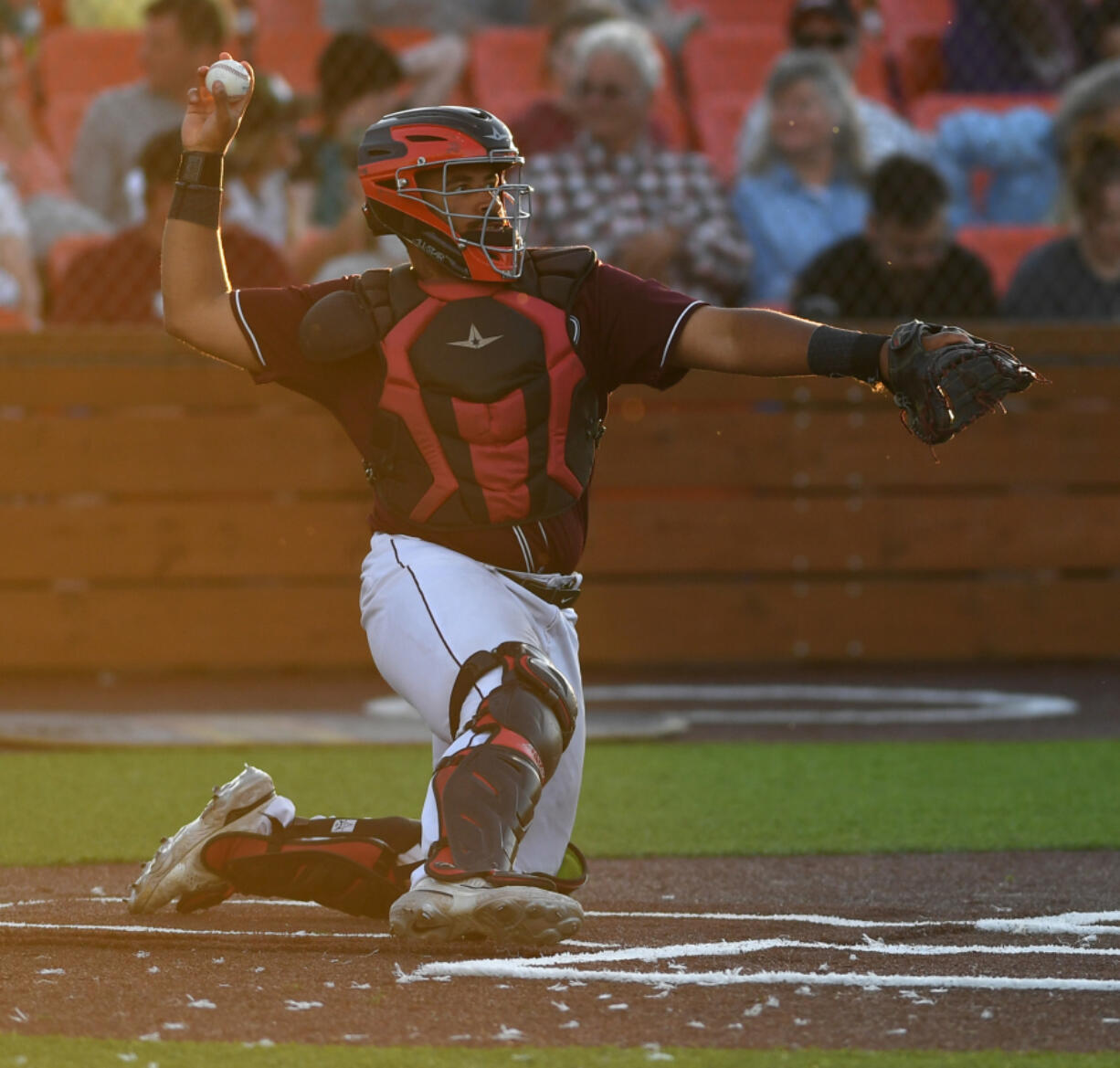 Raptors catcher Isaac Lovings throws the ball Friday, June 24, 2022, during a game between Ridgefield and the Victoria HarbourCats at the Ridgefield Outdoor Recreation Complex.