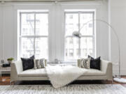 Accents such as an area rug and toss pillows help to create a modern setting.