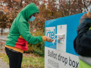 Meron Worku drops off her ballot on Tuesday, Nov. 3, 2020, at Rainier Beach Community Center, in Seattle, Wash.