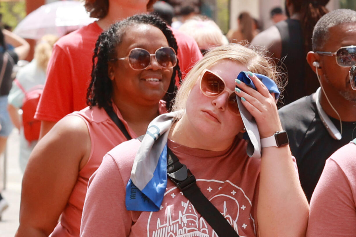 A crowd braves the hot weather at Universal CityWalk in June. According to one survey, Orlando, Fla., is the "sweatiest city" in all of America. (Stephen M.