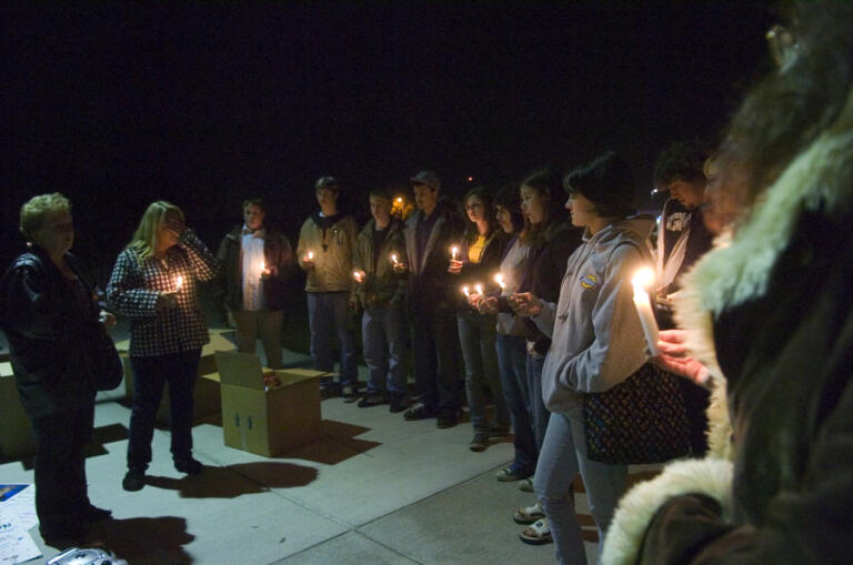 Stephanie Johnson, left, mother of Chelsea Harrison, and Sylvia Johnson, Chelsea's grandmother remember the 14-year-old Evergreen High School student murdered in 2005 as they stand at Gretchen Fraser Park during a candlelight vigil with family and friends of Chelsea on Nov. 2, 2007, in Vancouver. They were asked to bring toys and food for distribution by the city to the needy during the holiday season.