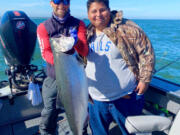 Bill Monroe Jr (left) and a lucky client with a dandy Buoy 10 Upriver Bright fall Chinook. Prospects for this year?s fishery are excellent, although the season is constrained by low numbers of returning lower Columbia wild tule Chinook.