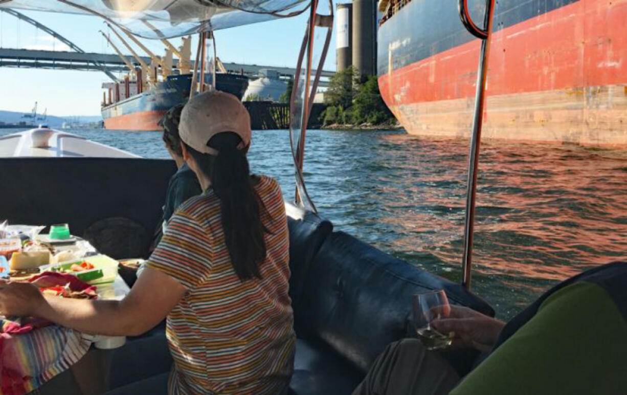 Taking in Portland history, and Willamette River behemoths, from a rental electric boat.