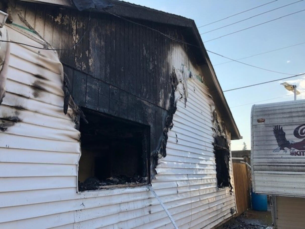 A house that caught fire Thursday morning in the Barberton area. Two construction workers who spotted the fire on their way to work Thursday morning helped pull an 11-year-old girl from the burning house.