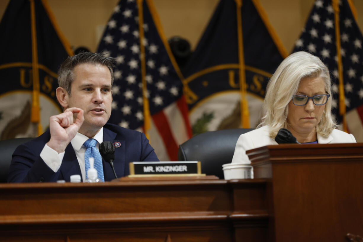 House Select Committee to Investigate the January 6th Attack on the U.S. Capitol member Rep. Adam Kinzinger (R-IL), left, delivers closing remarks during a prime-time hearing, with Vice Chairwoman Rep. Liz Cheney (R-WY) in the Cannon House Office Building on July 21, 2022, in Washington, D.C.