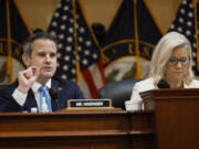 House Select Committee to Investigate the January 6th Attack on the U.S. Capitol member Rep. Adam Kinzinger (R-IL), left, delivers closing remarks during a prime-time hearing, with Vice Chairwoman Rep. Liz Cheney (R-WY) in the Cannon House Office Building on July 21, 2022, in Washington, D.C.