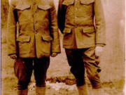 A postcard depicts artist Lewis Grell, right, dressed in a World War I Army uniform and standing with another soldier, likely at the Vancouver Barracks in 1918. Already a well-known artist, Grell (1887-1960) was a soldier of the Spruce Division, but when armistice was declared, production ceased. The postcard's back is a brief note to his sister Helen in Council Bluffs, Iowa.